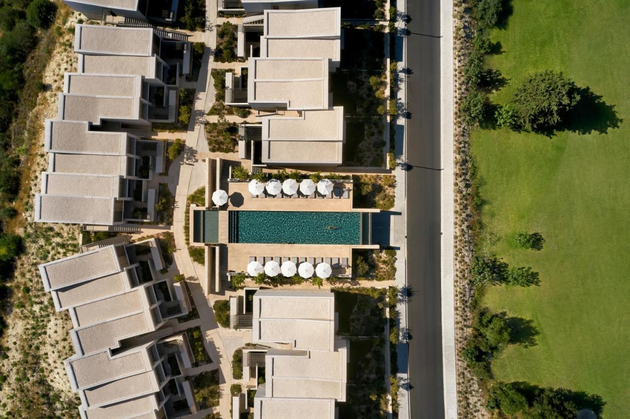 Minthis Resort Cáda Kültér fotó Aerial view of the hotel